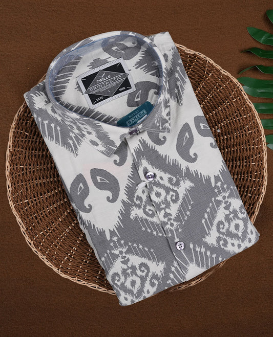 Off white colour shirt featuring stylish grey prints all over, Designed with a classic shirt collar and short sleeves, this shirt offers a modern yet casual appeal.