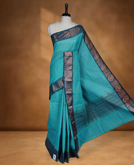 Aqua colour sungudi cotton saree featuring gold zari check pattern across body, contrast Teal colour with gold zari pattern on border, without blouse piece.