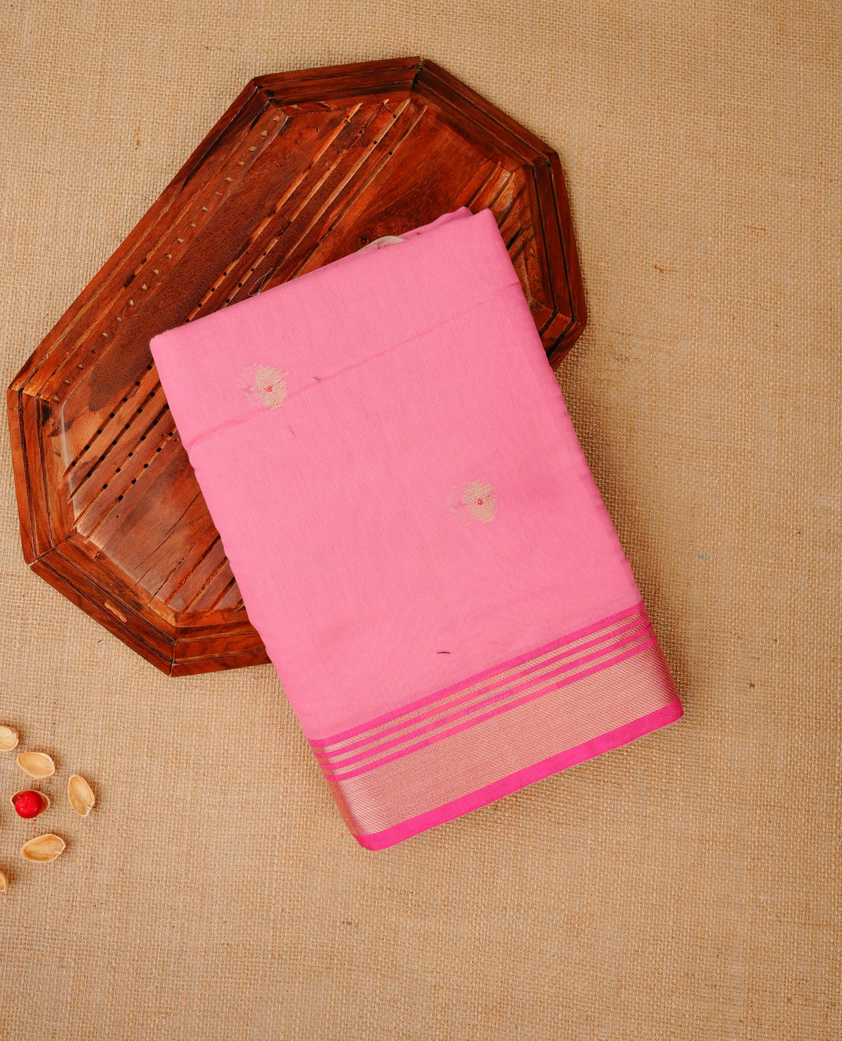 Baby pink colour Maheshwari cotton saree, gold zari floral motifs on body, complement self colour gold zari border comes with matching blouse.