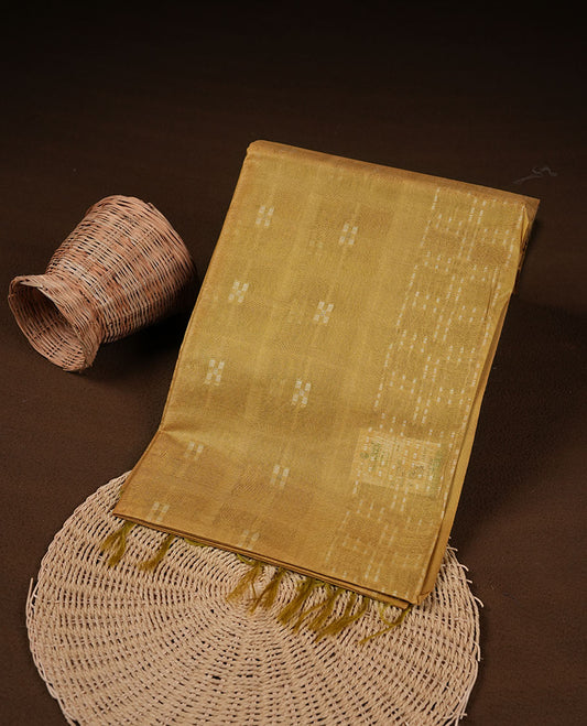 Mustard colour semi jute saree highlighting white thread motifs on body, without border and paired with matching blouse.