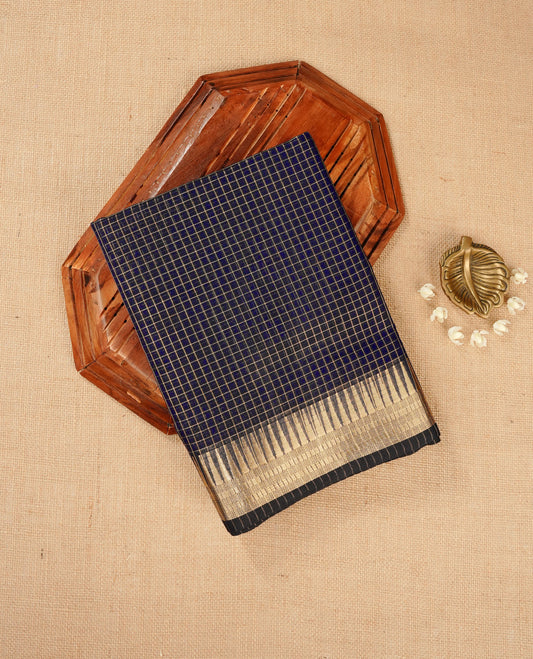 Black colour Maheshwari cotton saree, gold zari small checks on body, complement self colour gold zari temple design border comes with matching blouse.