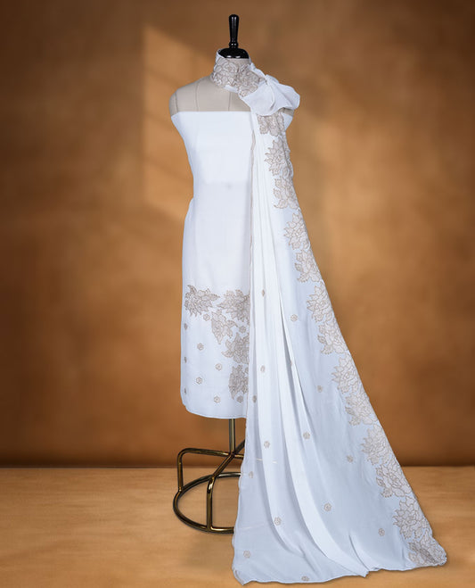 Off White colour georgette salwar material with elegant thread work on the body, paired with a flowy dupatta featuring delicate detailing, and complemented by a plain bottom for a graceful finish.