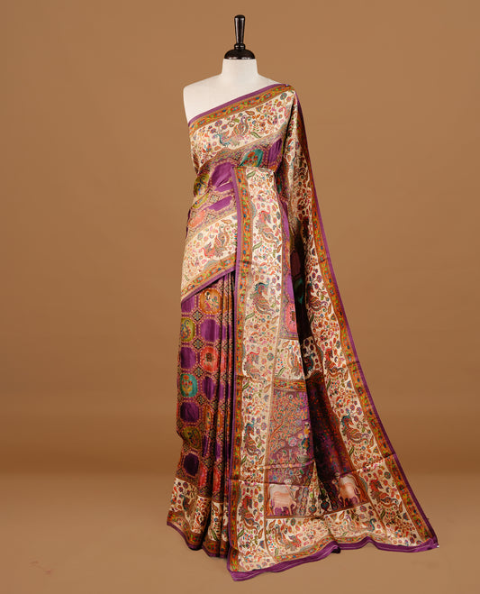 Purple colour Pashmina Saree featuring multicolour geometric and paisley woven body, a contrast multicolour floral & bird border with Purple edging, an ornate paisley woven pallu, paired with a matching blouse.