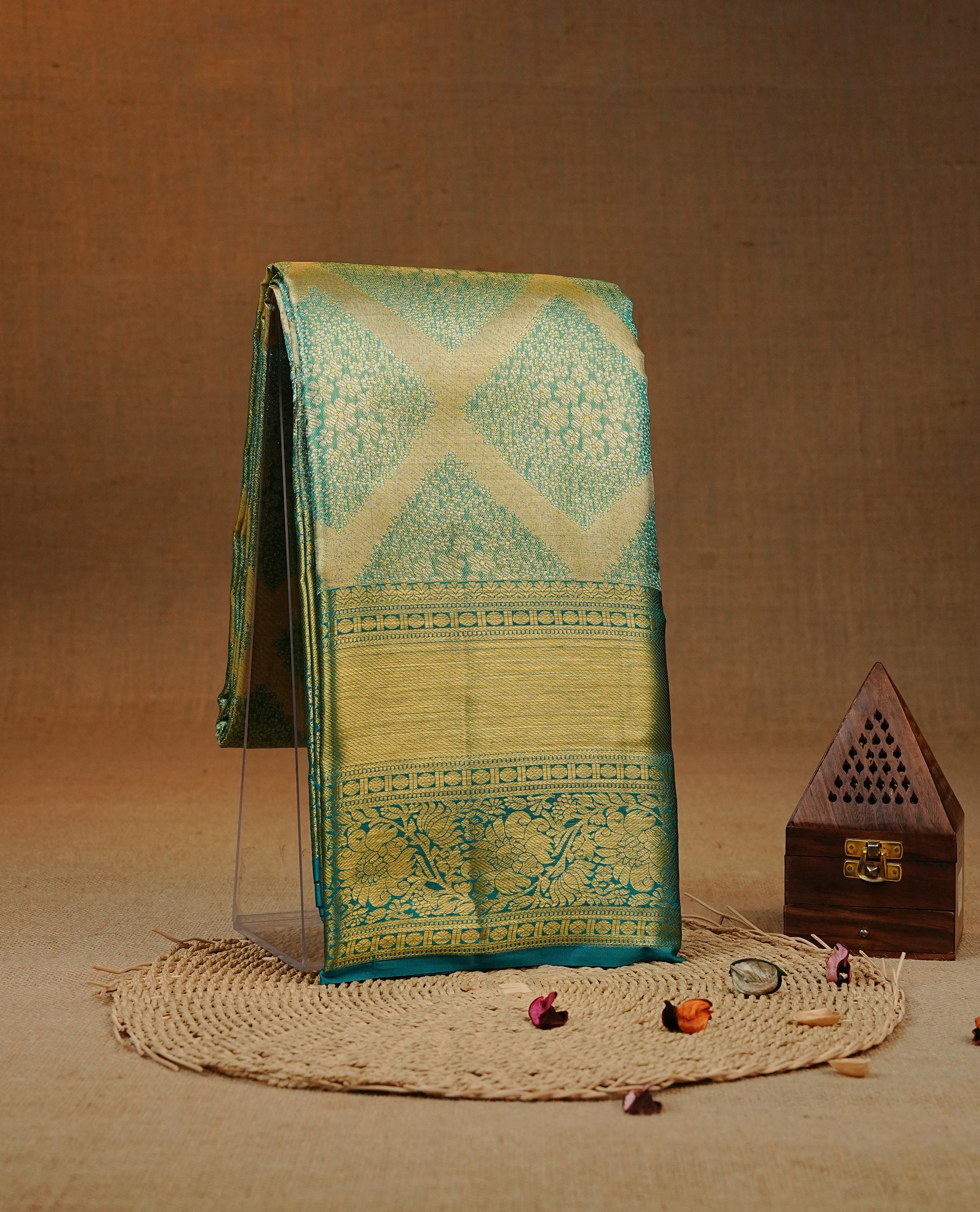 Blue & Gold double shade colour tissue silk saree featuring gold Pattern on body, complemented by self colour with Gold Zari border, comes with matching blouse piece.