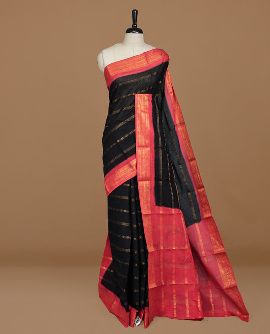Black colour Sungudi cotton saree featuring Gold zari Stripes on body, Gold zari on Contrast red colour border, paired with matching blouse piece.
