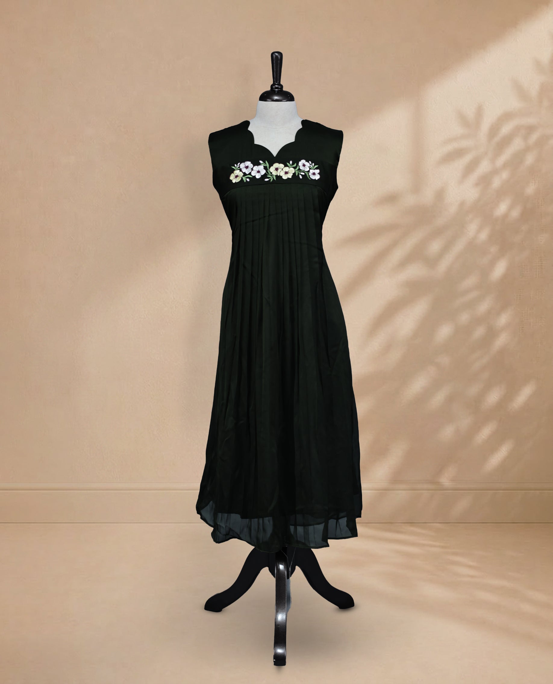 Deep Forest Green Coloured Sleeveless Kurti Featuring a Designed Neckline, Floral Embroidery on the Body