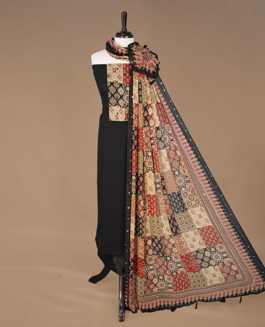 Black colour georgette salwar suit collection featuring plain body enhanced with elegant black bunch kalamkari print on neck yoke, detailed with subtle mirror work , paired with kalamkari printed dupatta with mirror work with santon material bottom.