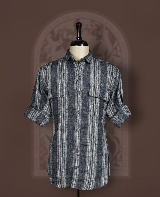 Charcoal black colour cotton linen blended shirt featuring self striped detailing and a breathable textured weave, Designed with double flap chest pockets, roll up sleeves, and a button-down front.