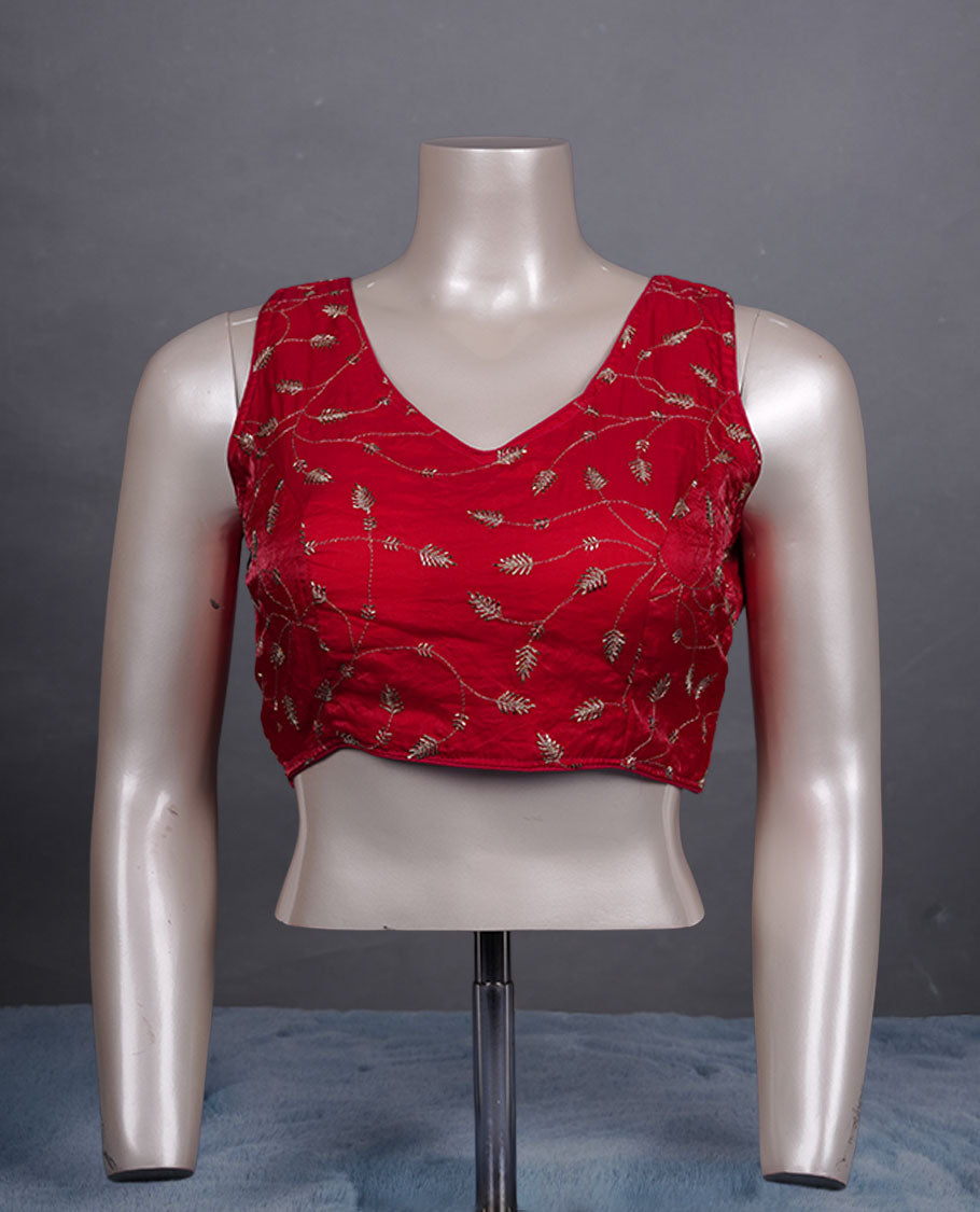 Red colour embroidered padded blouse with gold vine detailing, V neckline, and tie-back finish.