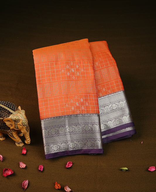 orange colour semi wedding silk saree featuring light gold zari checks with buttas on body, contrast purple colour with traditional border on body, rich pallu comes with matching blouse piece