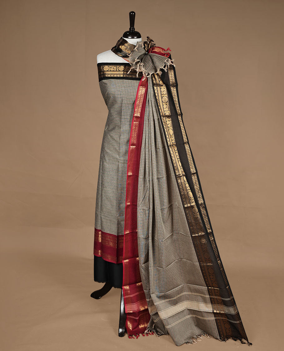 Grey colour chettinad salwar set featuring check pattern on body,contrast red colour with gold zari border, paired with matching bottom and dupatta.