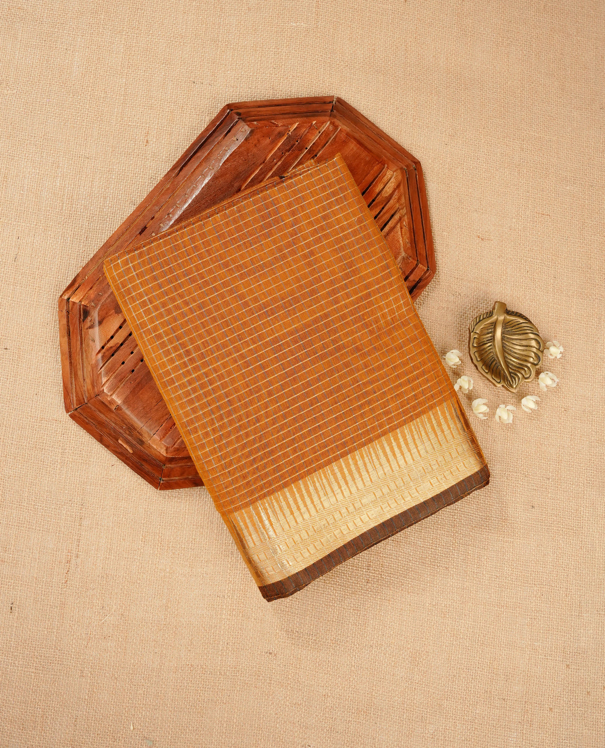 Mustard yellow colour Maheshwari cotton saree, gold zari small checks on body, complement self colour gold zari temple design border comes with matching blouse.