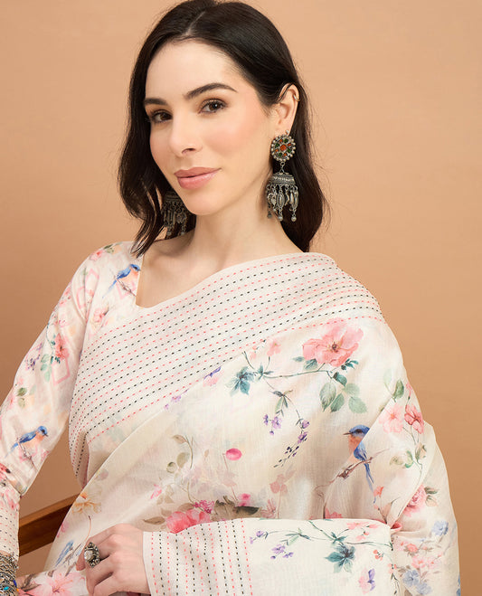 Cream toned semi tussar saree featuring delicate multicolour floral prints on the body, accented with a pastel hued Katha style stitched border and peach & green printed pallu Comes with a matching floral printed blouse for a graceful look.