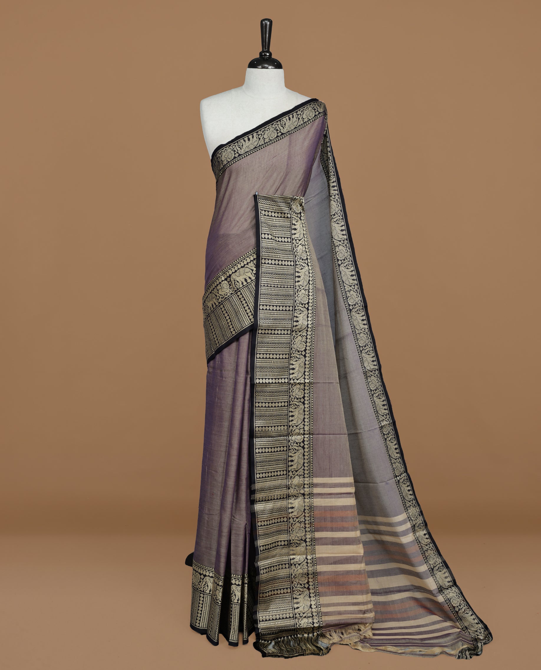 Greyish Lavender colour Narayanapett cotton saree Featuring Elegant plain Body, complemented by Contrast Black colour with cream zari border, paired with matching blouse piece.