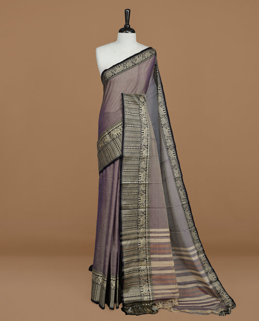 Greyish Lavender colour Narayanapett cotton saree Featuring Elegant plain Body, complemented by Contrast Black colour with cream zari border, paired with matching blouse piece.