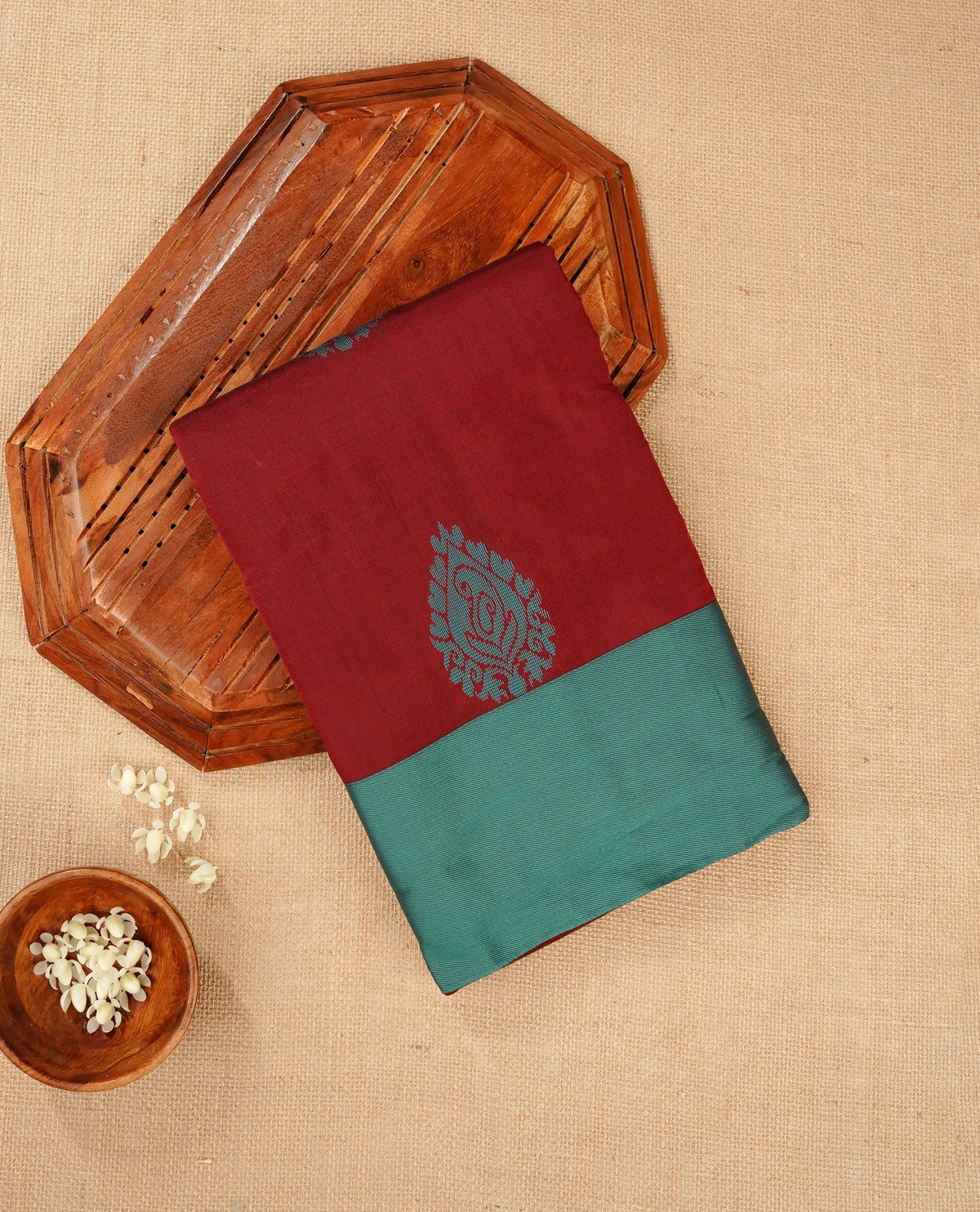 Dark maroon colour silk cotton saree featuring aqua colour thread motifs on body thread detiled contrast borders & pallu, comes with matching blouse piece