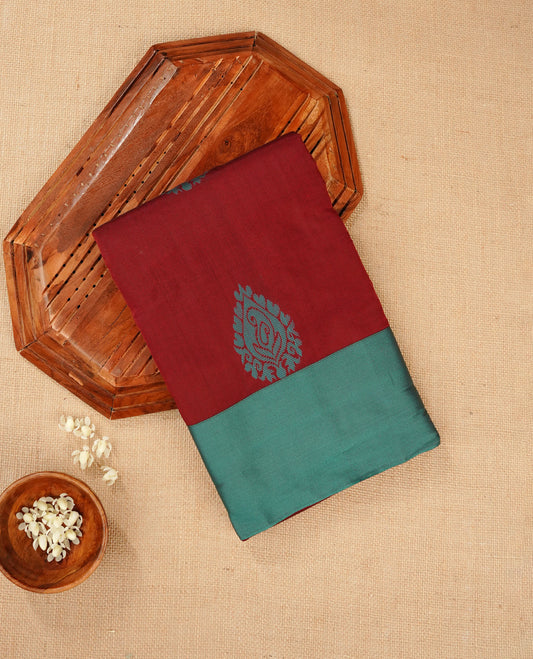 Dark maroon colour silk cotton saree featuring aqua colour thread motifs on body thread detiled contrast borders & pallu, comes with matching blouse piece