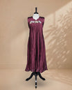 Wine Berry Coloured Sleeveless Kurti Featuring a Designed Neckline, Floral Embroidery on the Body
