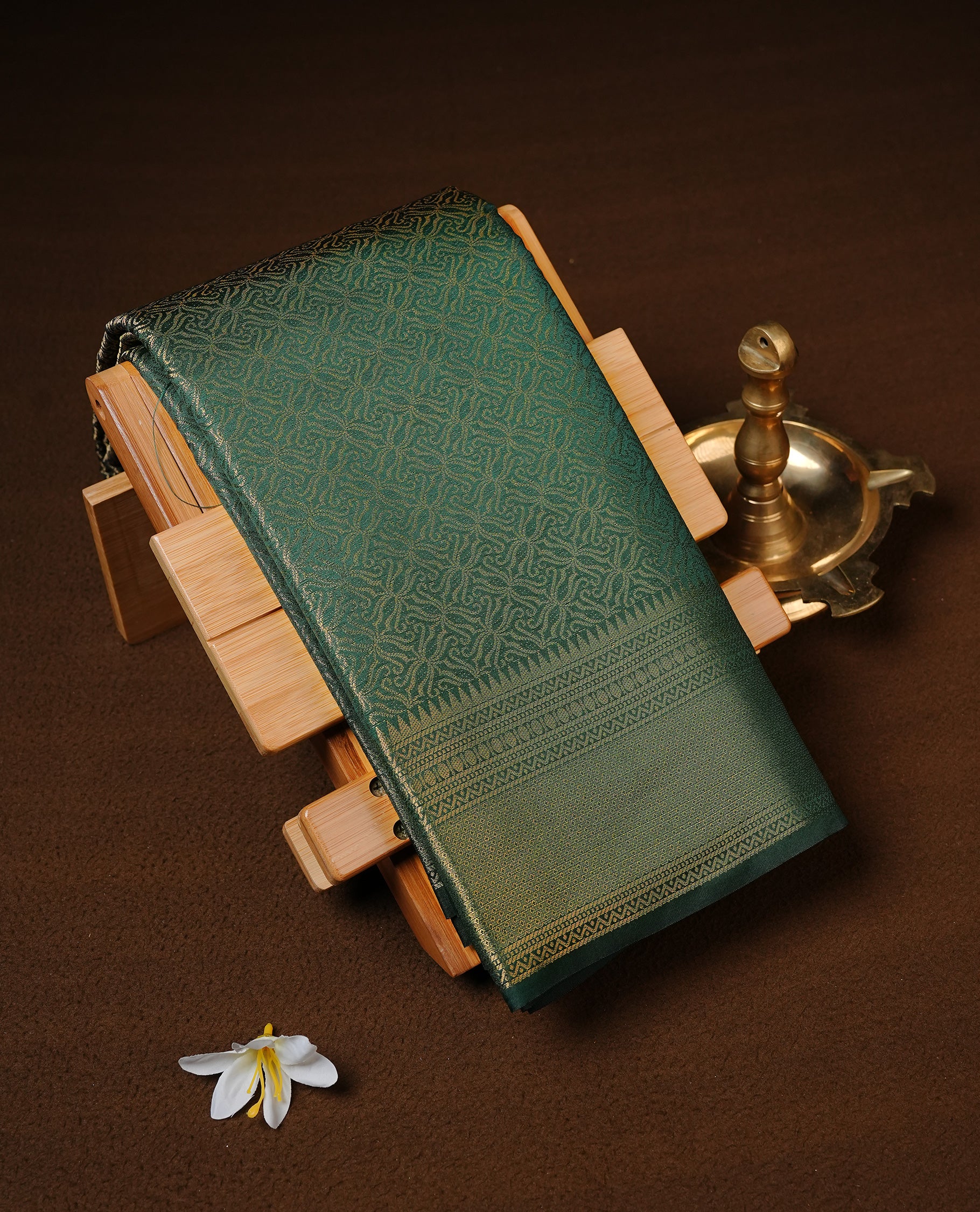 Bottle Green colour Semi Wedding silk saree featuring gold zari kodi pattern across body, complemented by self colour with traditional border, paired with matching blouse piece.