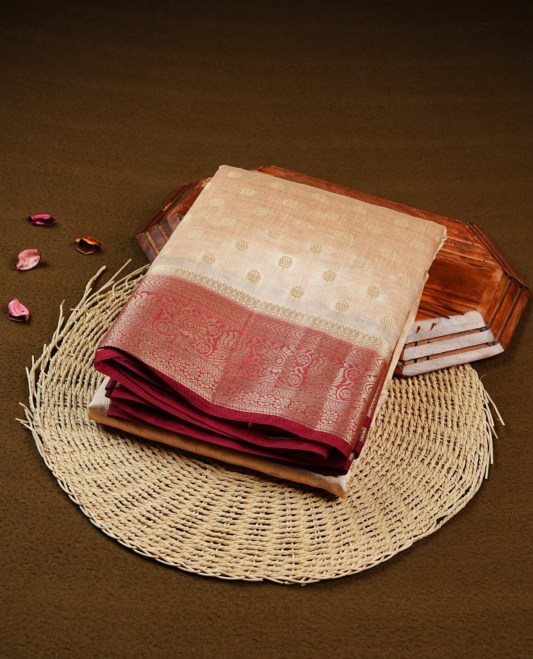 Light Gold Tussar saree featuring Gold zari buttas on body, complemented by contrast Maroon Colour with Gold zari border, comes with matching blouse piece.