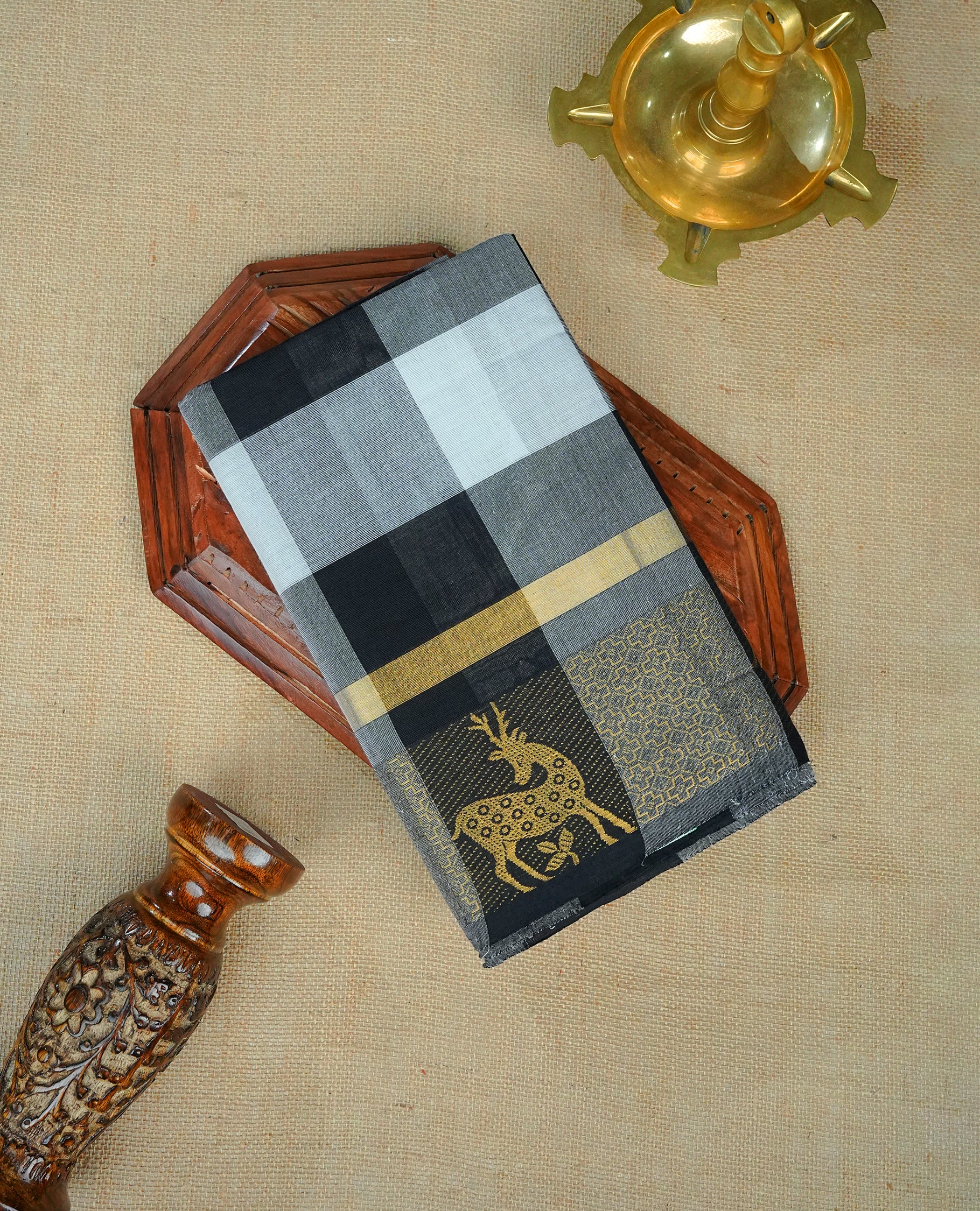 Black & White colour chettinad cotton saree featuring check pattern on body, complemented by Self Colour with gold zari border, comes with matching blouse piece.