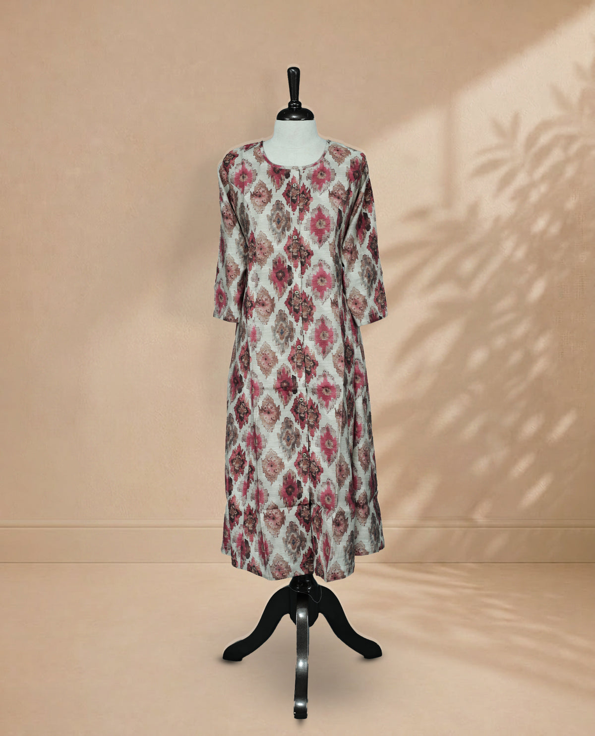 Grey colour  Kurti featuring digital prints on the body, a U-shaped neckline with buttons, and 3/4 sleeves.