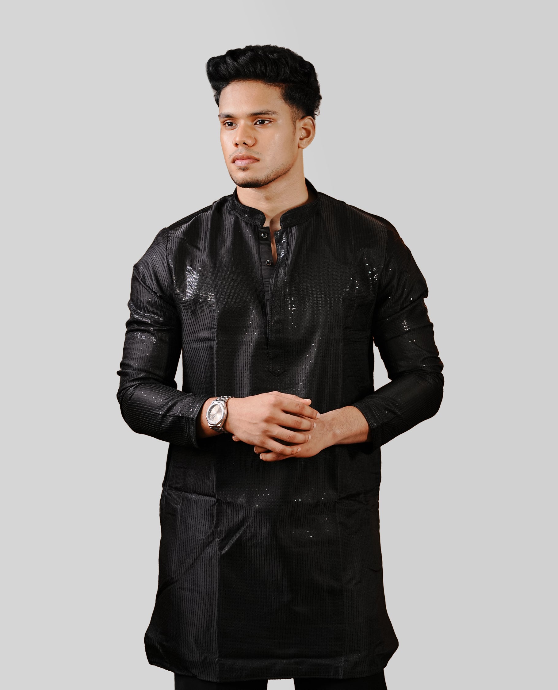 Black colour men's kurta featuring elegant thread and sequins work on the body, complemented by full sleeves for a refined and festive look.
