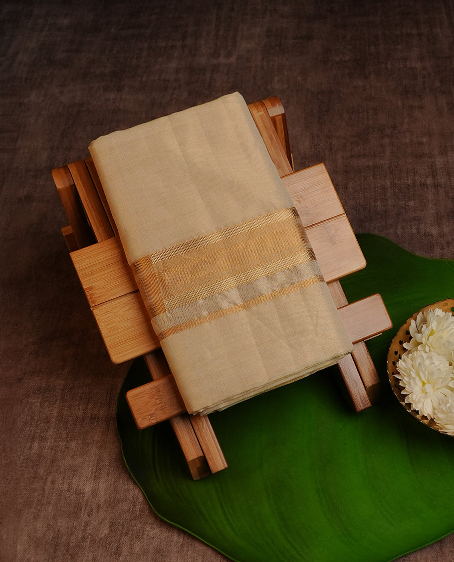 Cream colour pure tissue Double dhoti featuring plain with Gold zari kara.