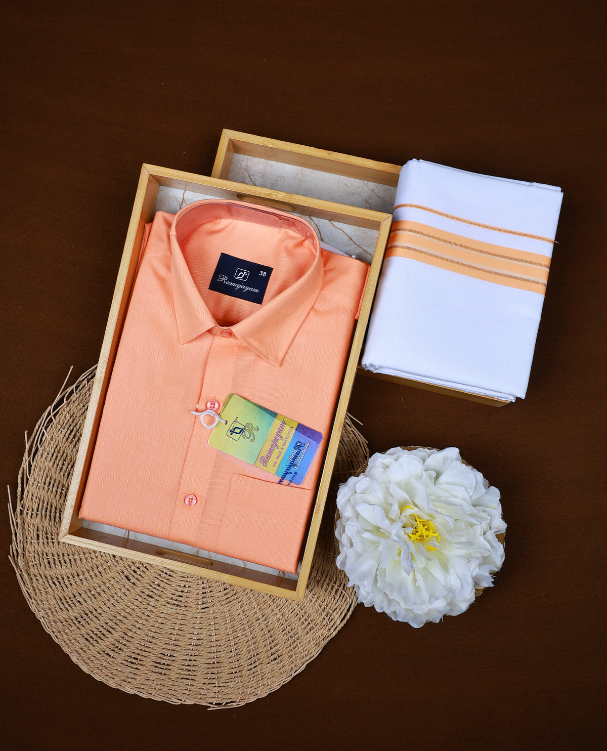 Orange colour RAMAJAYAM shirt paired with a matching dhoti, finishing with a orange kara