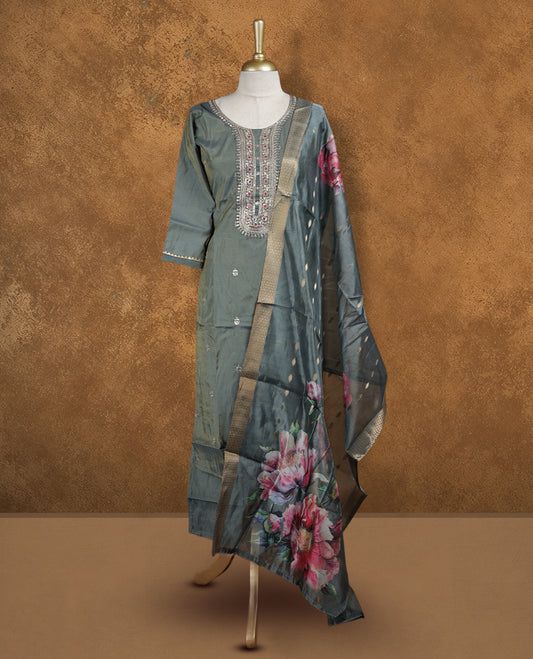 Olive green colour churidar set featuring thread and cut beats embroidered neckline, sleeves, and Gold colour motifs on body , Paired with a matching dupatta