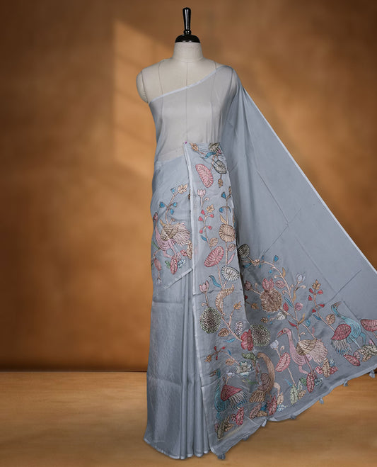 Grey colour organza saree featuring multicolour floral and bird printed motifs on the pallu with a subtle fine border, paired with a matching printed blouse.
