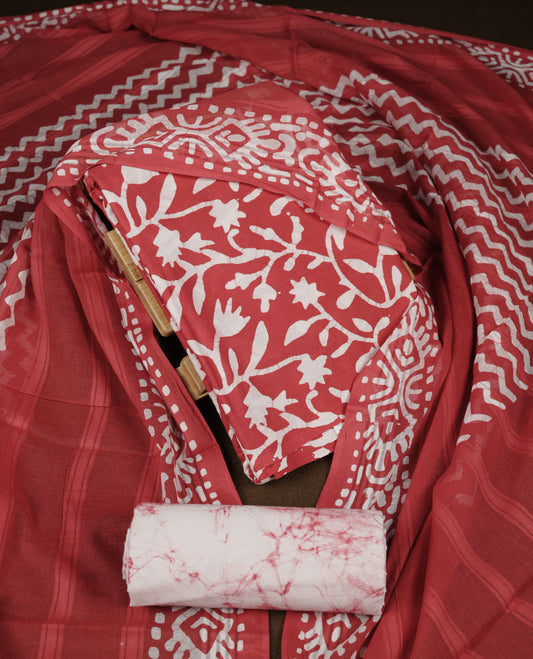 Red colour churidar material featuring white floral printed body, paired with a matching chevron printed dupatta.