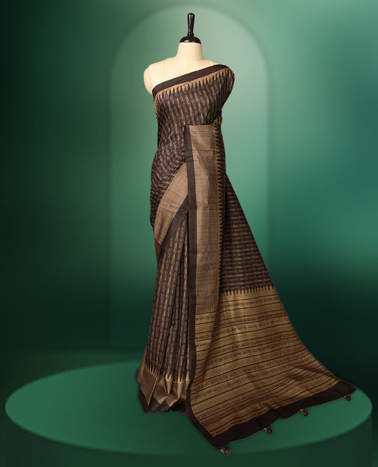 Deep Brown colour saree featuring prints all over the body, complemented by a sleek woven border and pallu, and paired with a matching blouse