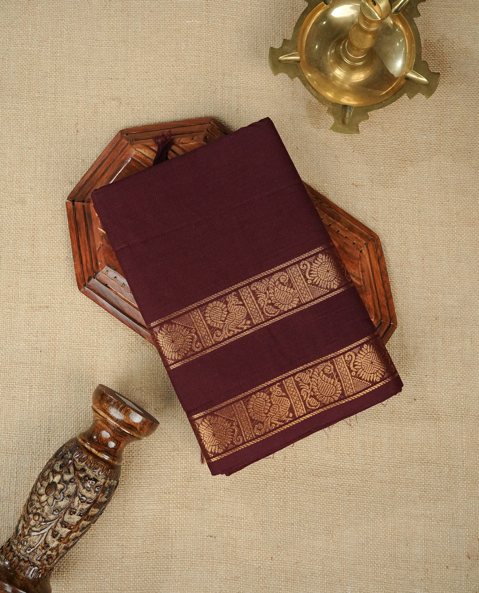Chocolate colour chettinad cotton saree featuring Elegant plain body, gold zari on self colour border, comes with matching blouse piece.