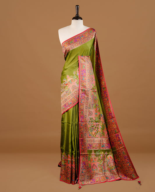 Olive green colour Pashmina Saree featuring Plain body, a contrast multicolour Temple & Paisley woven motifs border with red edging, an ornate paisley woven pallu, paired with a matching blouse.