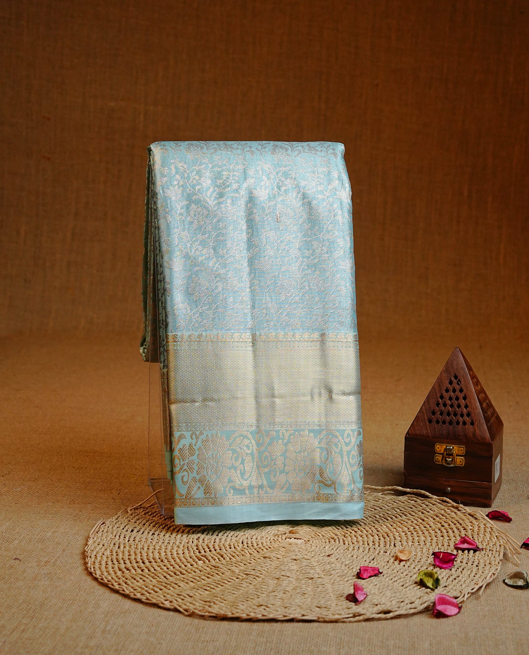 Ice blue colour Double shade Semi tissue silk saree featuring Light gold zari Kodi pattern on body, Contrast colour with traditional border, paired with matching.