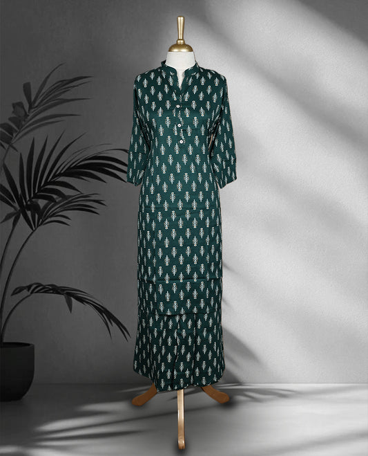 Dark green colour cord set adorned with delicate white leaf motifs, featuring a straight fit kurta with a mandarin collar and matching pants.