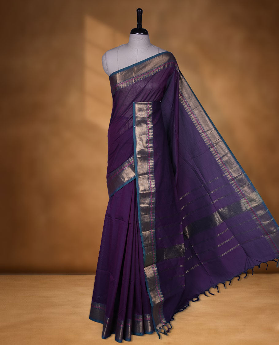 Purple colour chettinad cotton saree featuring Elegant plain body, contrast green colour border with gold zari border, pallu and paired with matching blouse.