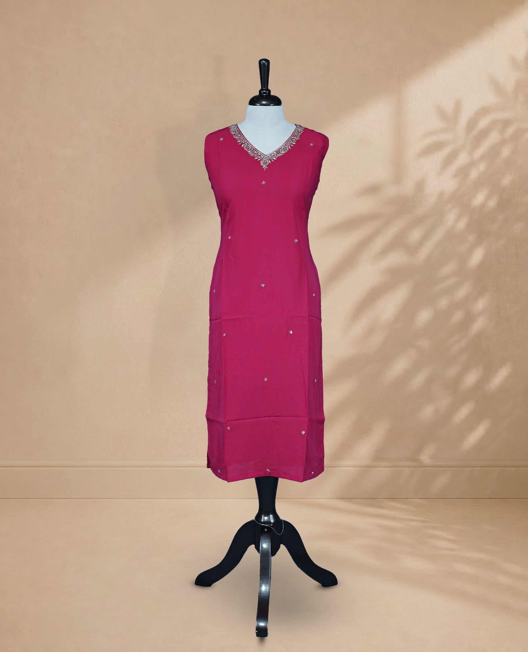 Rani Pink Kurti featuring sequin and beadwork across the body, a V-shaped neckline adorned with bead and sequin work, and a sleeveless design.