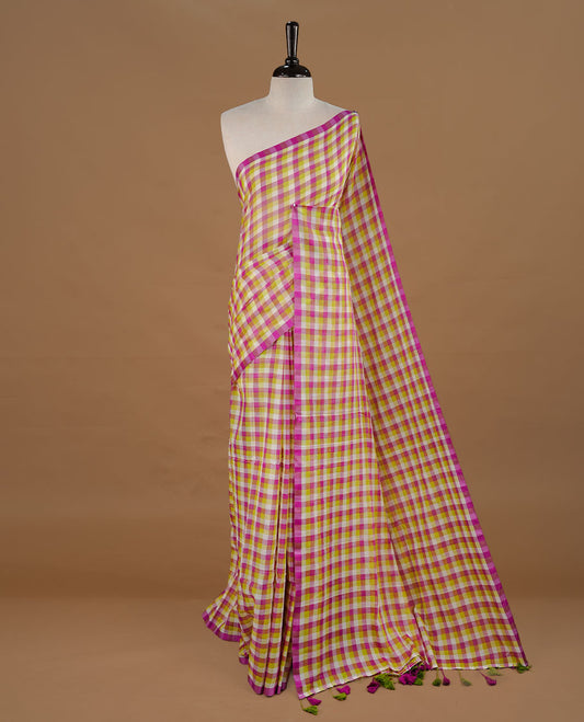 Green, Purple and White colour Mul Cotton saree featuring a classic Big check pattern on the body, accented with tassels for added charm. Comes without a blouse piece.