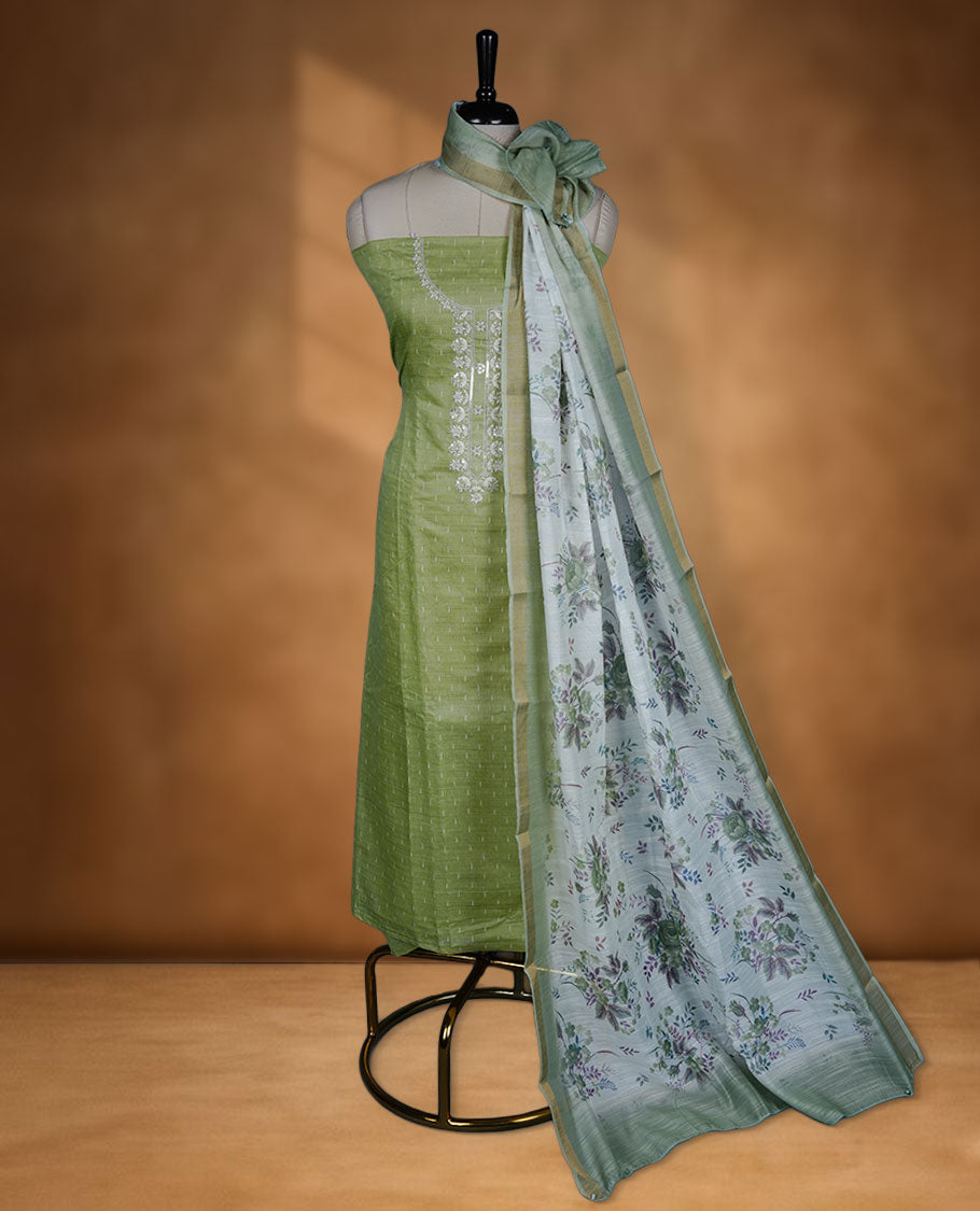 Pista green colour semi chanderi salwar material small strip thread work on the body, sequence on neckline and dupatta floral print and small gold border, paired with a plain bottom.