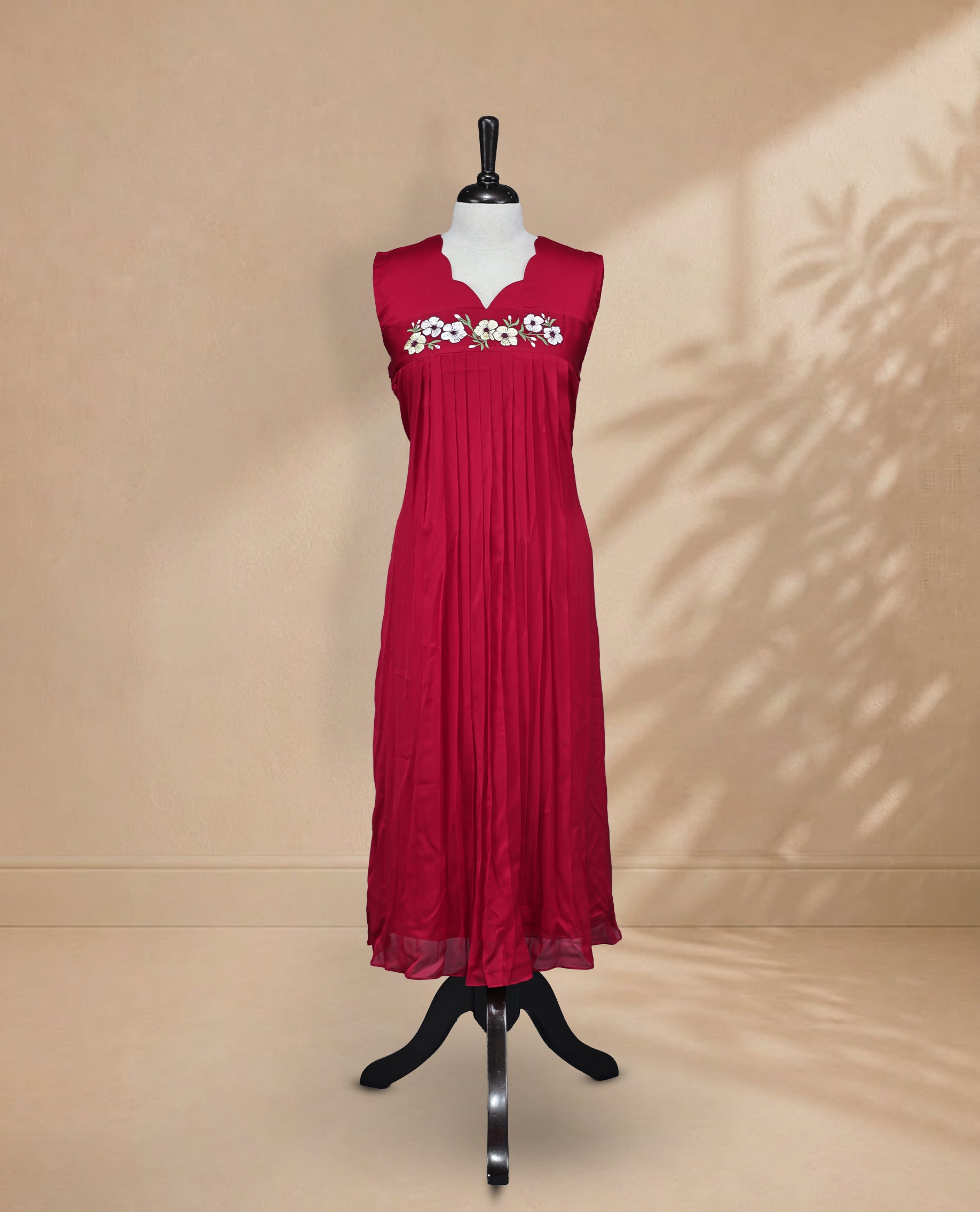 Red Coloured Sleeveless Kurti Featuring a Designed Neckline, Floral Embroidery on the Body