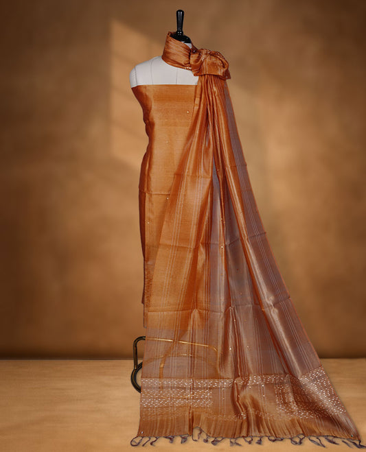 Mustard shade Tussar suit material with elegant thread detailing on the body, paired with a plain bottom and a worked Tussar dupatta.