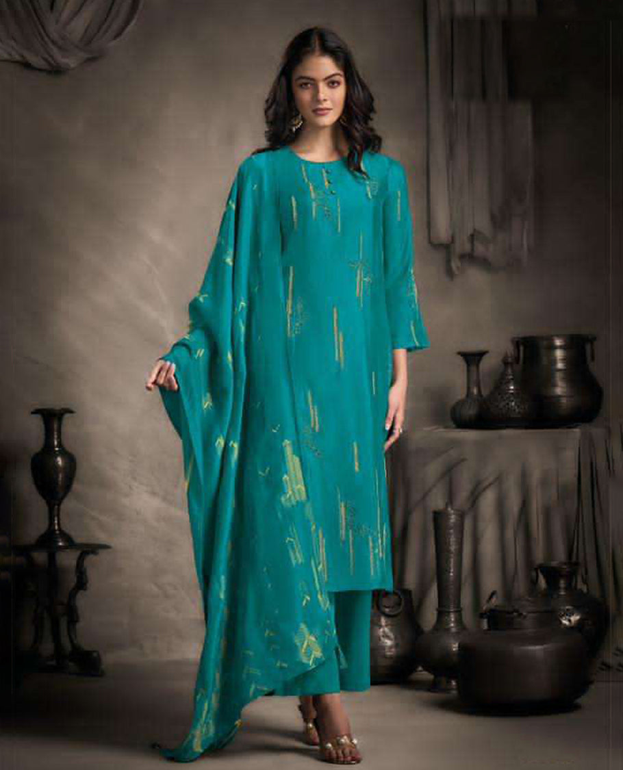 Pine green colour suit material with Rubina silk top adorned with elegant embroidery work, paired with luxurious satin bottoms, and completed with a muslin jacquard dupatta featuring rich woven detailing
