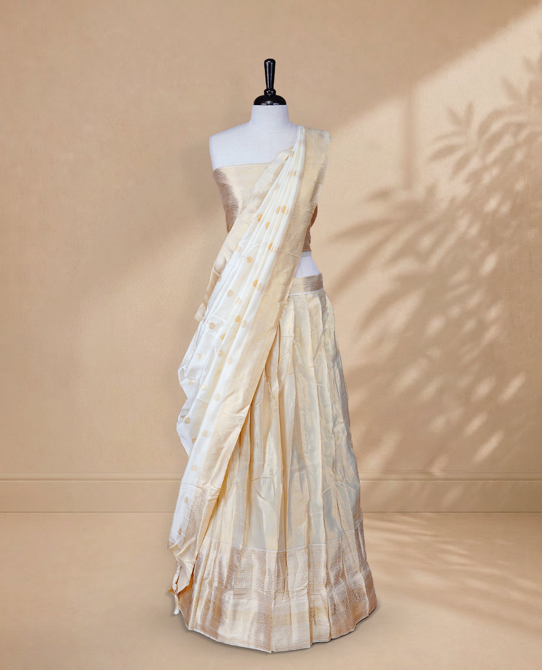 Golden colour Half saree featuring Plain skirt with Traditional zari on self colour border, Unstitched Blouse and matching dupatta.