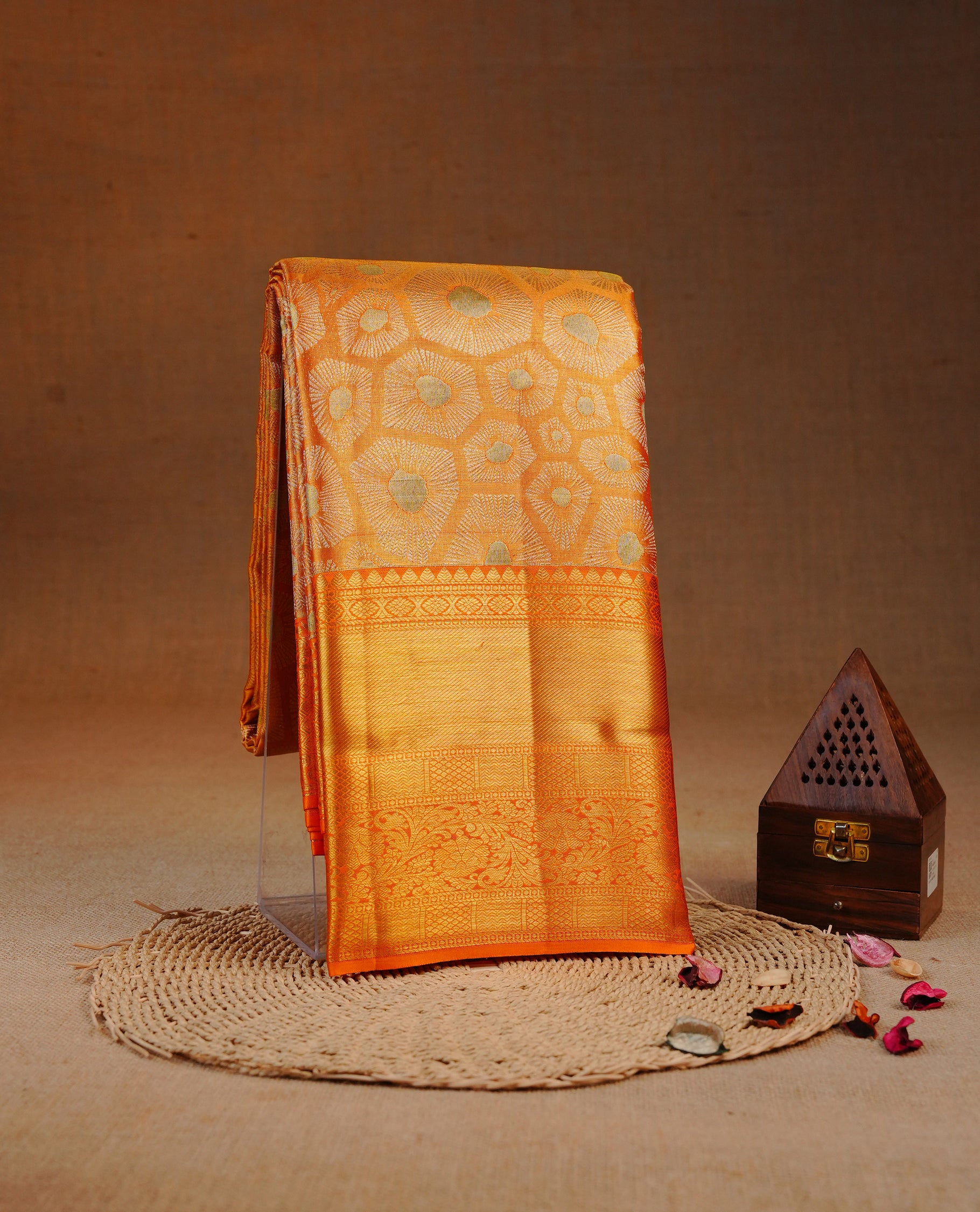 Orange & Gold double shade colour Tissue silk saree featuring gold motifs on body, complemented by self colour with Gold Zari border, comes with matching blouse piece.