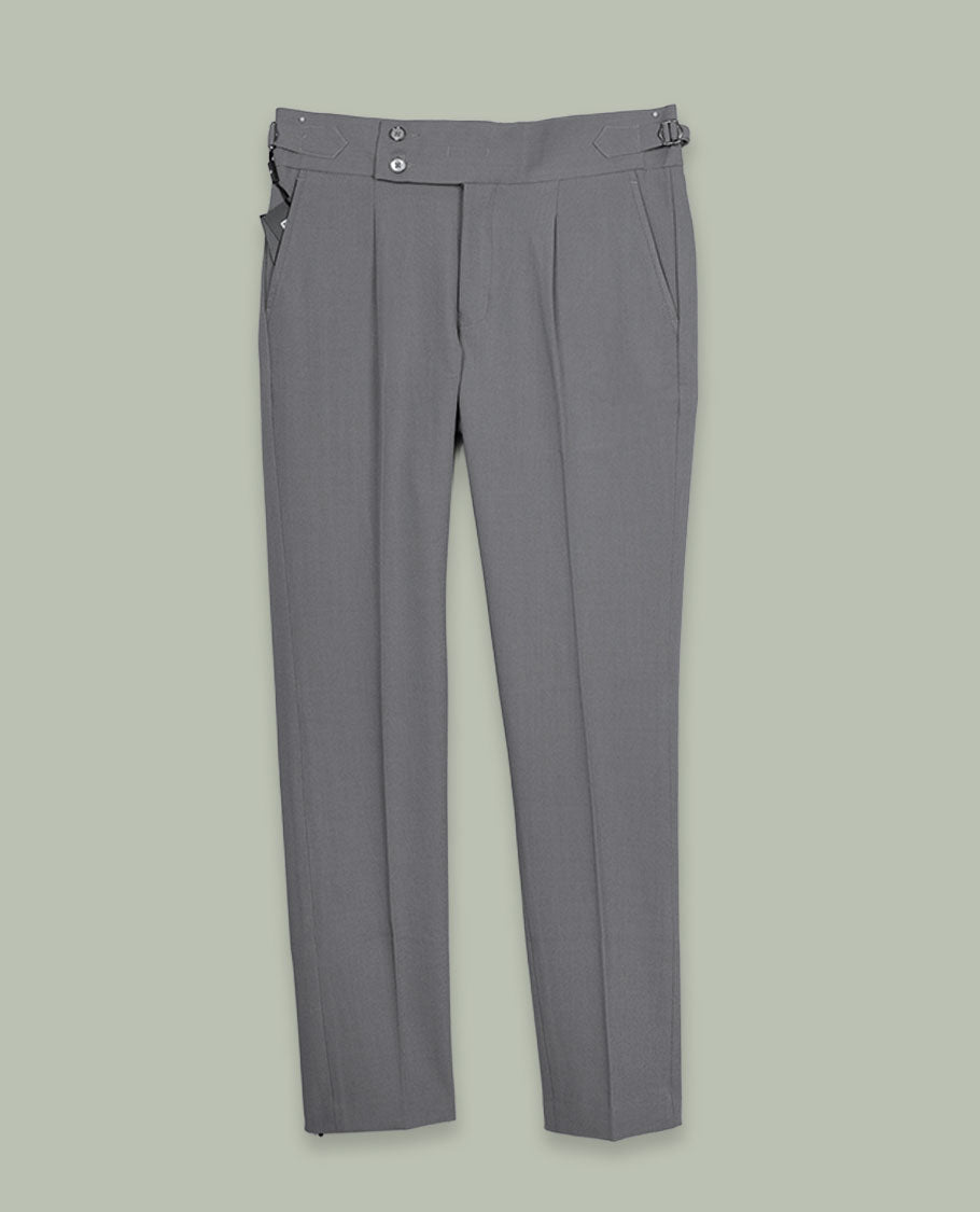 Grey colour men’s pant featuring a clean waistband with side buckle adjusters, neat front pleats, slant pockets and back welt pockets, finished with a straight leg fit.