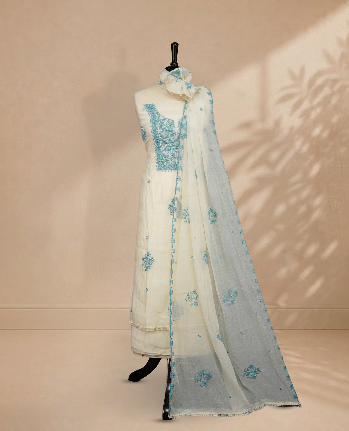 Ivory Colour Mul Chanderi Salwar material featuring Light Blue Embroidery & Delicate Bead Work on body, paired with Santon bottom & Embroidery Worked Dupatta With Scallop border.