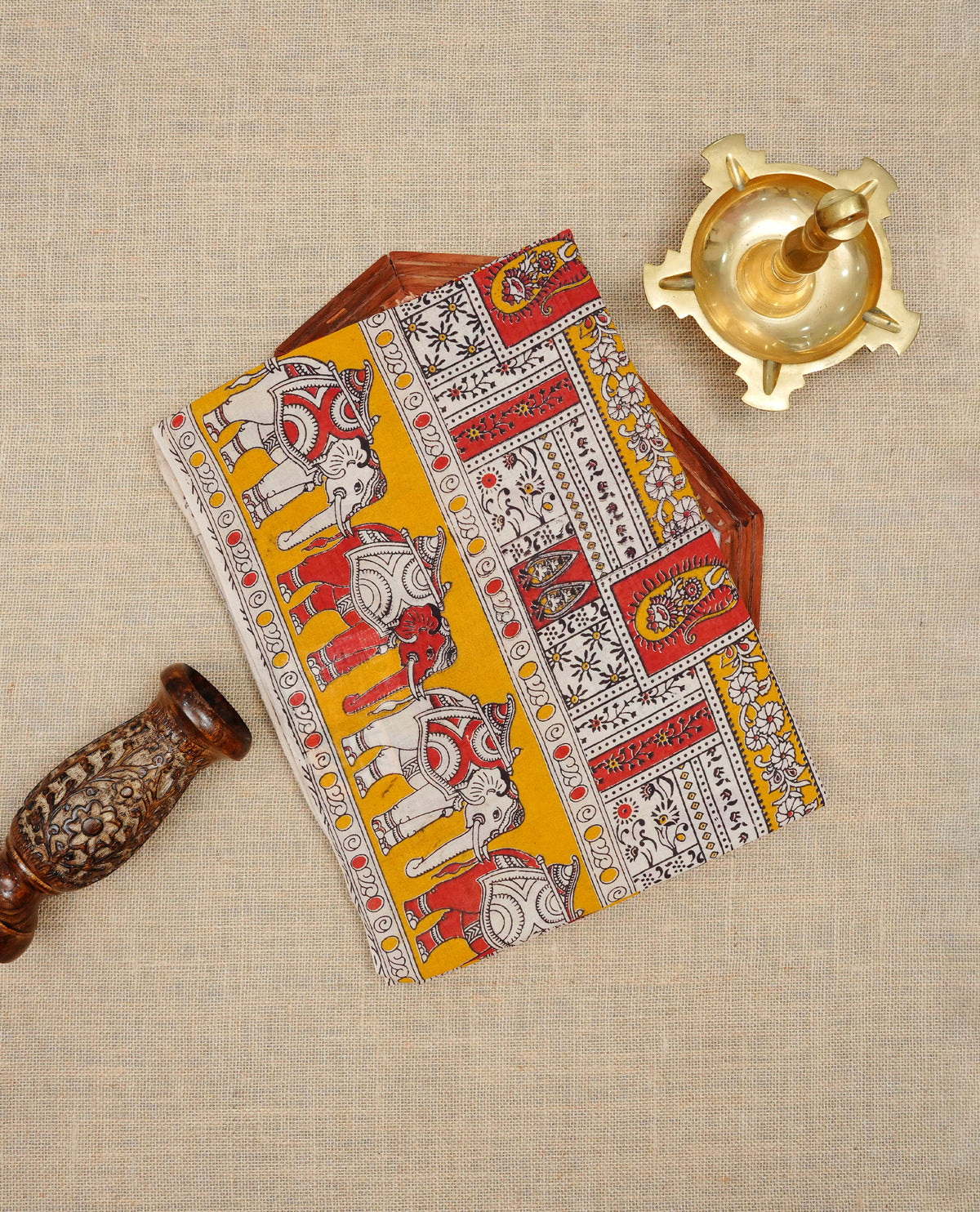 Cream , mustard yellow & red colour kalamkari cotton saree featuring kalamkari printed body & pallu, paired with a matching  contrast blouse piece.