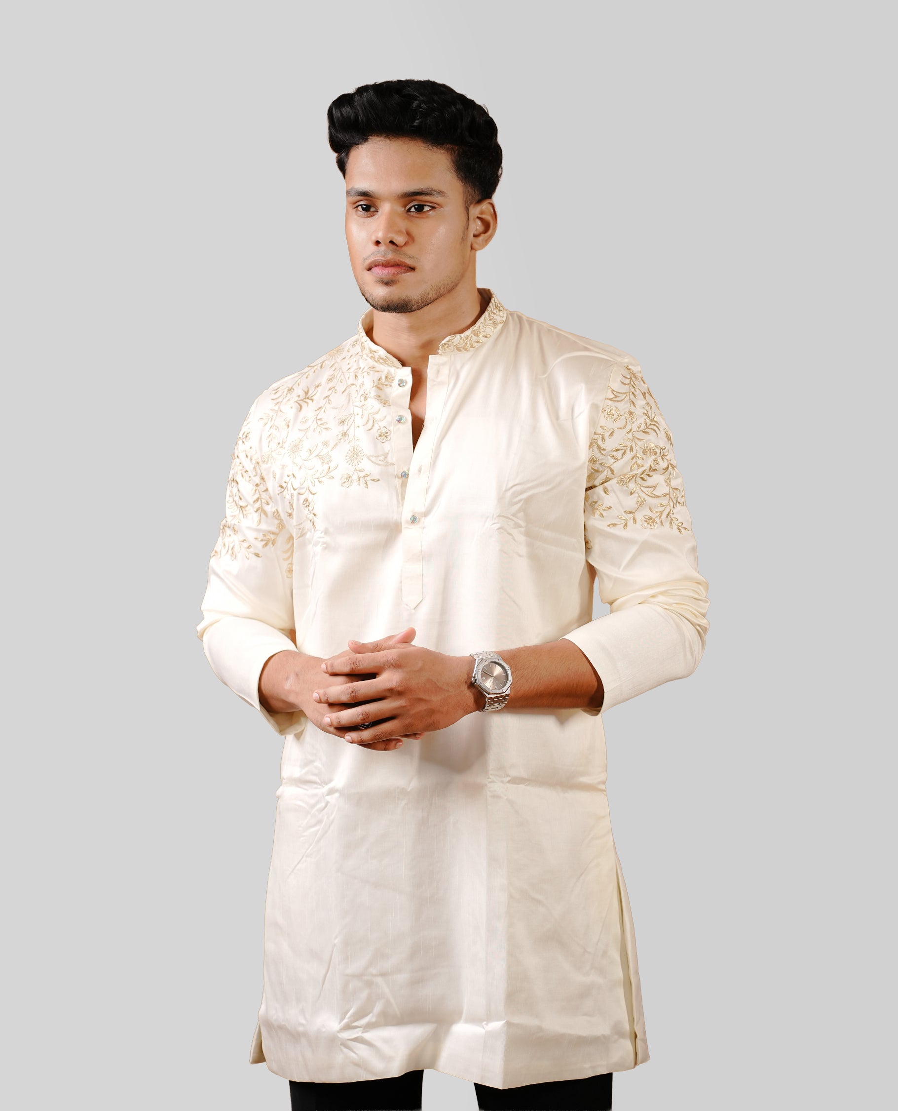 Cream colour men's kurta featuring elegant gold thread work on the body, complemented by full sleeves for a refined and festive look.